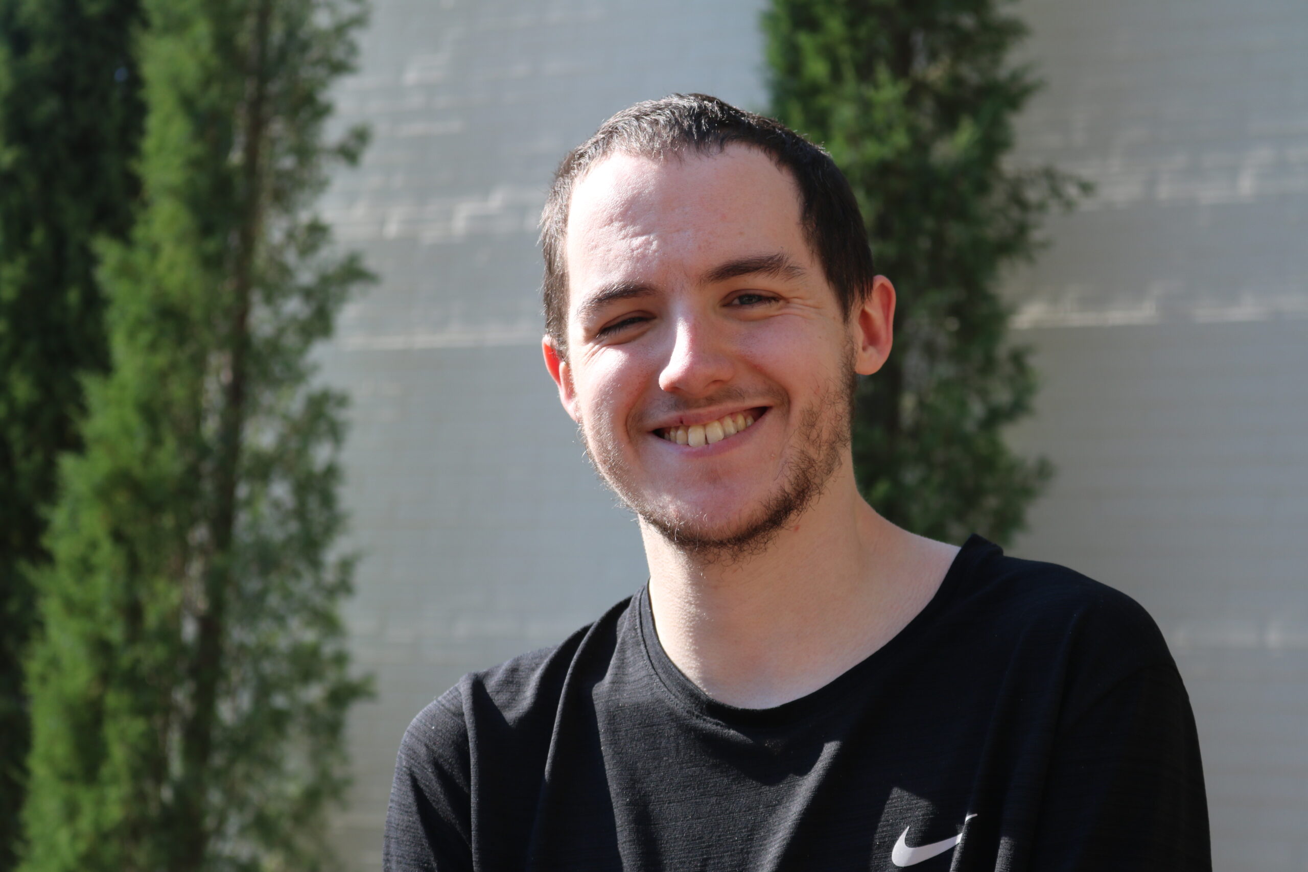 A young man smiling