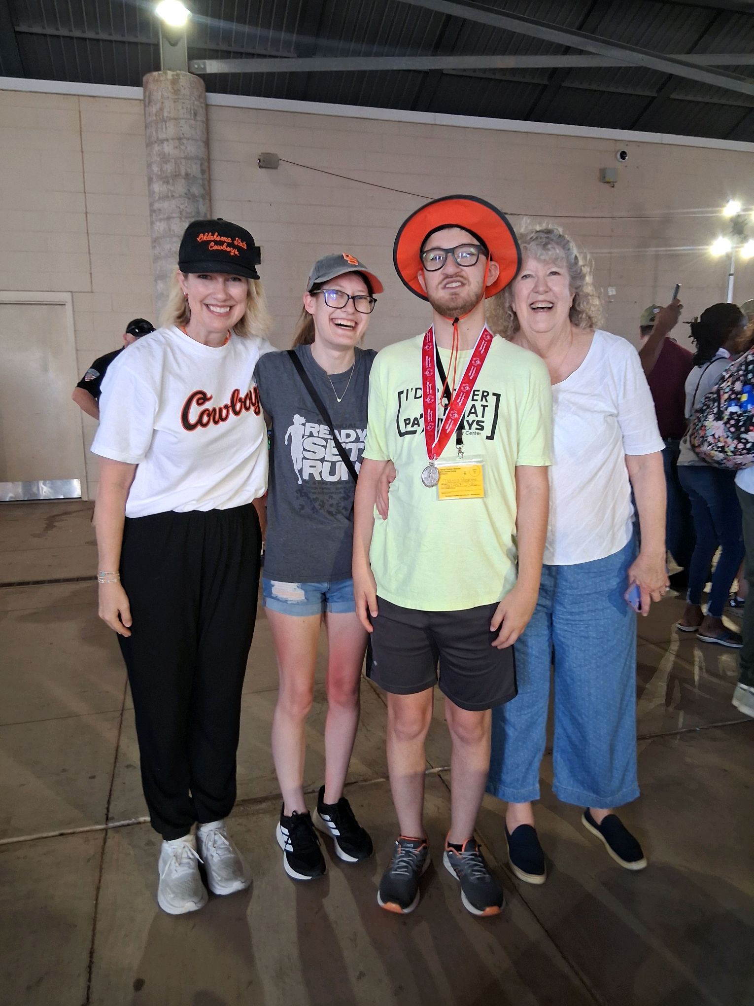 Josh Miller and family SOOK Pathways student Josh Miller at Special Olympics wearing the silver medal he earned in the 100 meter race surrounded by his family.