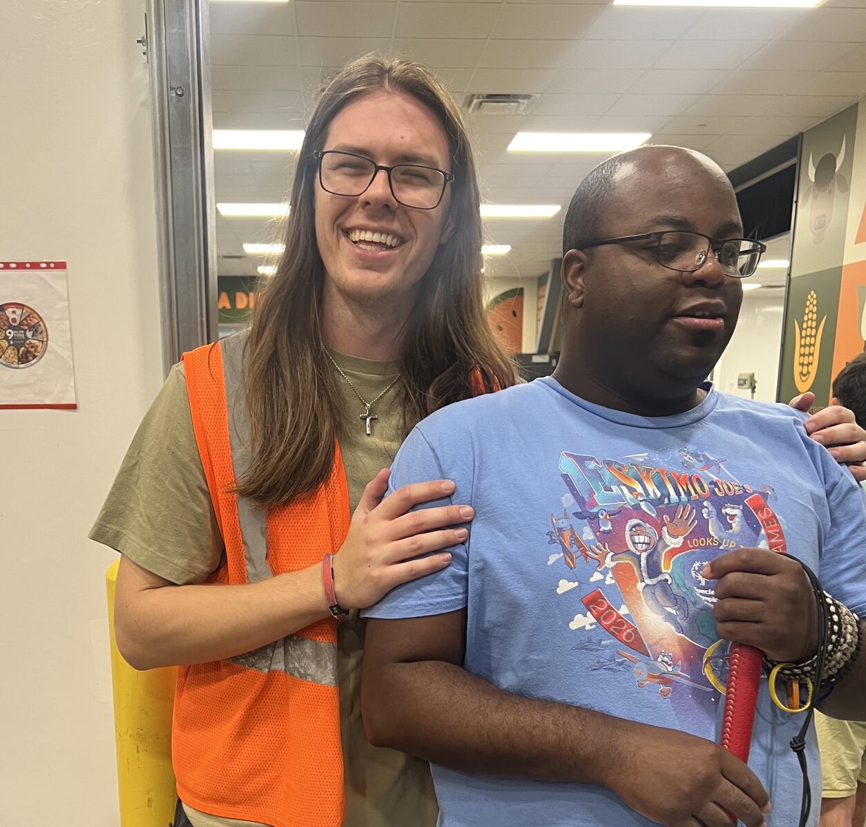 Pathways student Keith standing with a community volunteer at the Food Bank